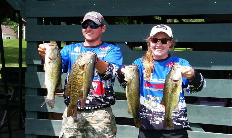 Students holding fish they caught